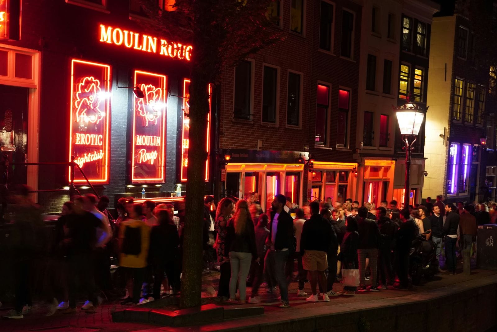 The Red Light District in Amsterdam. Photo by gio on Unsplash.