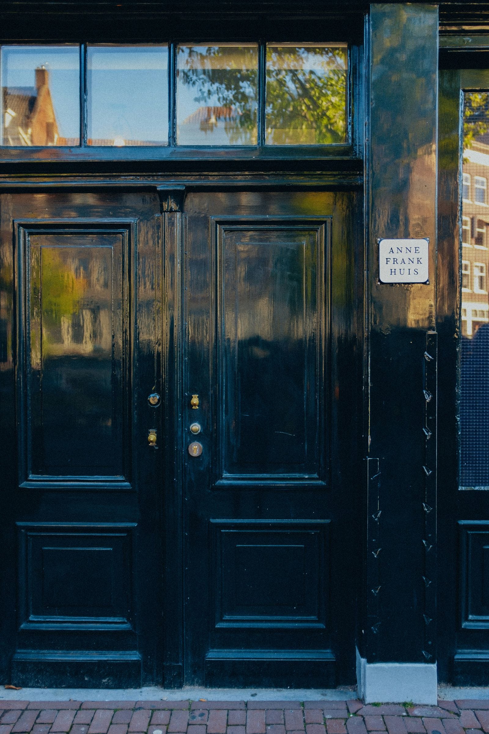 Entrance door to Anne Frank House in Amsterdam. Photo by Teresita Biafore on Unsplash.